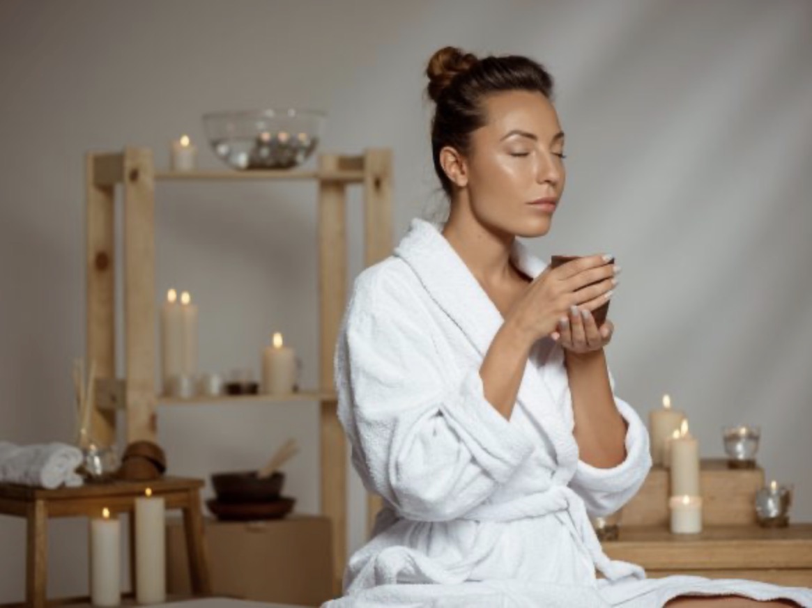 RE:ME Relax — woman in a white robe in a calm spa setting